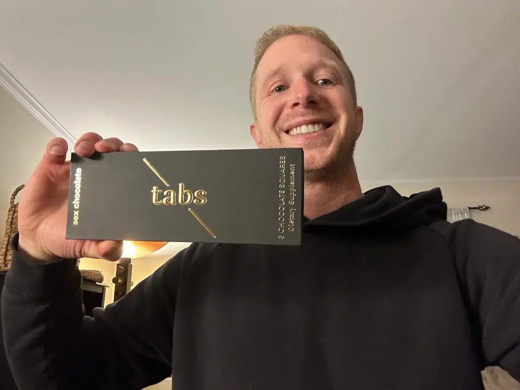 Me holding tabs chocolate package